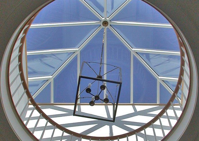 Design Details: Natural daylight, from as many different sources as possible, is an important consideration in all our work.  This large skylight, centered above a four story tall center stair hall provides daylight all the way down to the basement.  Operable windows around the perimeter allow for natural summertime ventilation.
